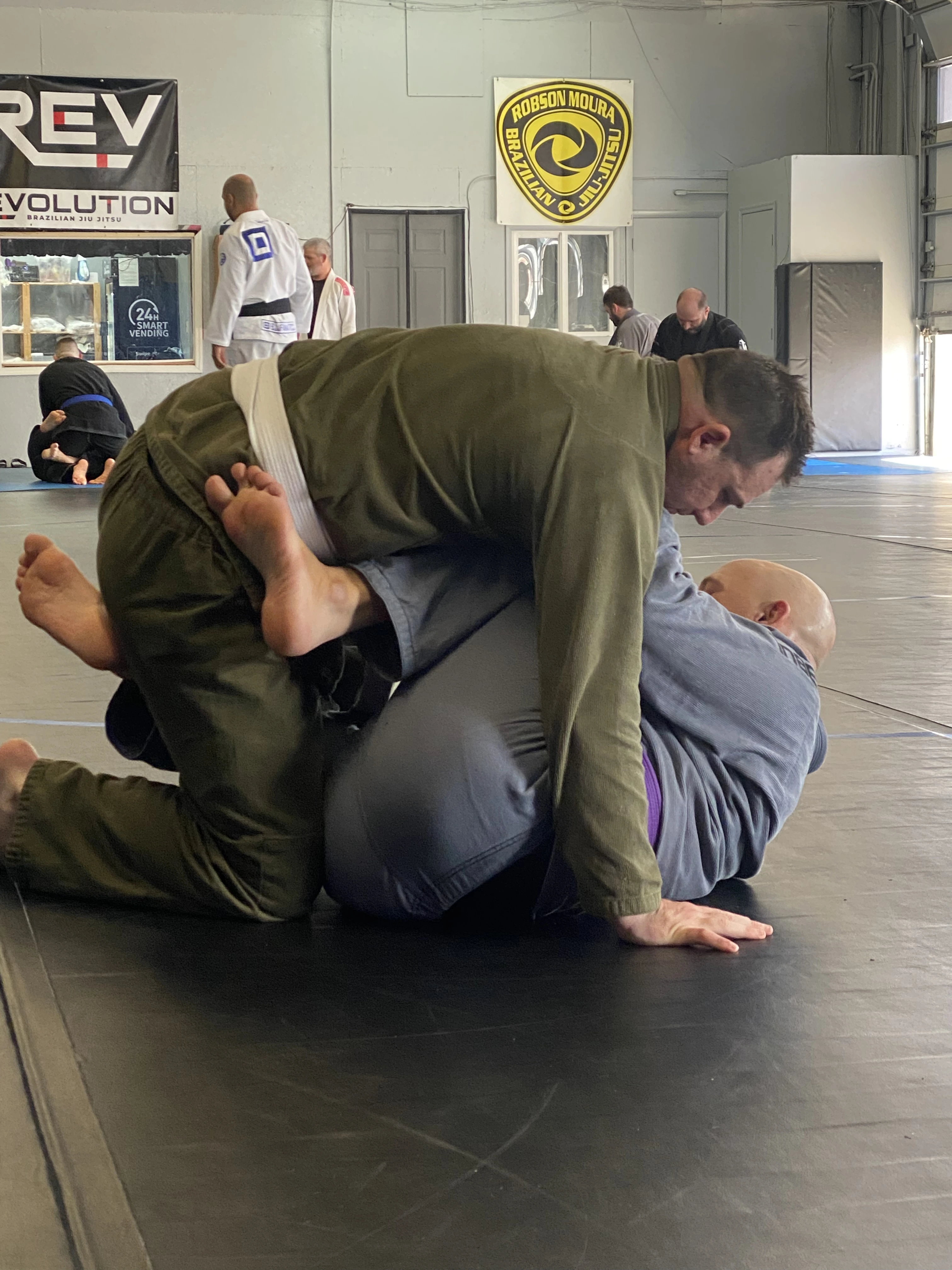 Adult BJJ class drilling